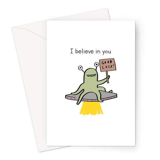 I Believe In You Greeting Card | Cute, Funny Alien Good Luck Card, Alien Sitting On UFO Holding Good Luck Sign, Flying Saucer
